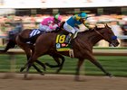 American Pharoah and jockey Victor Espinoza roar past Firing Line.