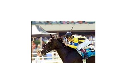Jockey Victor Espinoza rides Dance in the Mood to a win in the CashCall Mile, Saturday at Hollywood Park.
