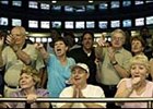 Patrons at Philadelphia Park watch as Smarty Jones wins the Preakness. The colt is one of many top horses that have called Philly Park home.