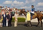 Ron McAnally (third from left) won the Bevery D with Eclair de Lune for Arlington Park chairman Richard Duchossis (2nd from left).