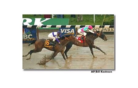 Empire Maker leads Ten Most Wanted to the wire in the Belmont Stakes.