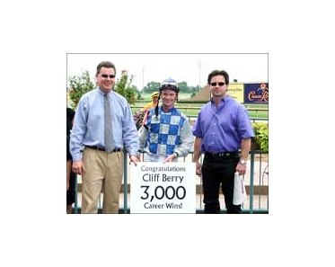 Lone Star Park GM Drew Shubeck (left) and trainer Bret Calhoun (right) flank Cliff Berry after his 3,000th career win.