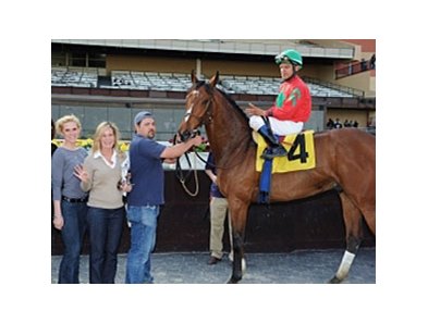 Linda Rice and Cornelio Velasquez in the Winner's Circle after they teamed up to win the 8th race at Aqueduct with Abilio.