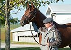 Beholder with trainer Richard Mandella.
