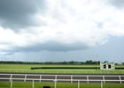 In this file shot, a storm arrives at the OBS Sales in Ocala, Fla., in June 2014.