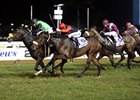 Rabada (green silks) takes the Daily News 2000.