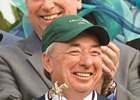 Paul Reddam holds the Kentucky Derby trophy after Nyquist's 2016 victory