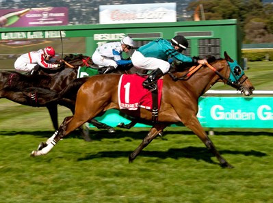 Central Heat with jockey Russell Baze wins the 2016 Golden Poppy