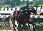 By the Moon comes home strong to take the Bed o' Roses Handicap.<br><a target="blank" href="http://photos.bloodhorse.com/AtTheRaces-1/At-the-Races-2016/i-vWLSZkk">Order This Photo</a>