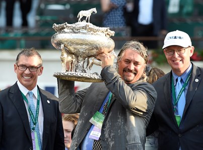Creator's co-owner Ken Troutt, left and Winstar's CEO Elliot Walden, right join trainer Steve Asmussen in the winner's circle after winning the 148th running of the Belmont Stakes. Photo by Skip Dickstein