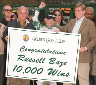 Russell Baze, center, celebrates his 10,000th victory with track management from both Golden Gate Fields and Bay Meadows.