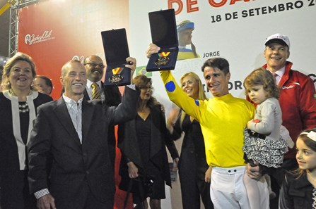 Russell Baze (left) and Jorge Ricardo celebrate after the International Jockeys Challenge in Brazil. Jorge Ricardo won the last race of the event while Baze finished fourth.