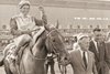 Owner John Galbreath accompanied by trainer Lou Rondinello, leads Preakness winner Little Current with jockey Miguel Rivers up.