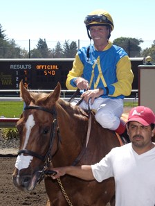 Russell Baze smiles wide after achieving 11,000 wins.