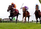 Harbour Law (left, orange silks) gets up late to take the St. Leger.