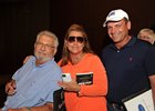 Buyer J. J. Crupi, left, with Samantha and Chris Baccari.