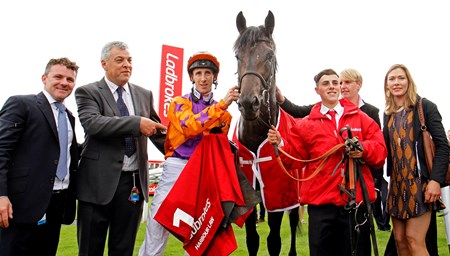 Harbour Law and George Baker (orange) win the 2016 Ladbrokes St Leger