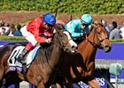 Queen's Trust (outside) and Lady Eli were a nose apart at the wire in the 2016 Filly & Mare Turf
