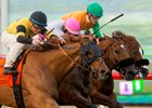 Ring Weekend (left) holds of Vyjack and Om to win the Seabiscuit Handicap