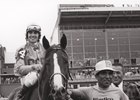 Eugene Roche leads Master Derby into the winner's circle after the 1975 Preakness Stakes