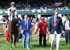 Preston Troutt of WinStar Farm leads American Patriot and Javier Castellano into the Keeneland winner's circle