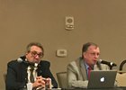 Robert O'Neil (left) and Scott Palmer discuss veterinary records