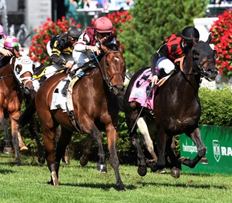 Divisidero with jockey Julien Leparoux up, left, out duels Beach Patrol with jockey Florent Geroux to the wire to win the 31st running of the Woodford Reserve Turf Classic May 6, 2017 at Churchill Downs in Louisville, Kentucky.