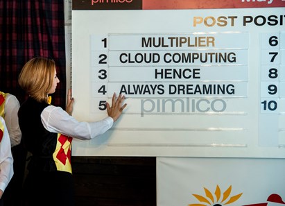 Abelian Kraus 24, of Belair, Maryland puts of the sign containing the name of the Kentucky Derby winner Always Dreaming in post position #4 for the 142nd running of the Preakness at Pimlico Race Course May 17, 2017 in Baltimore, Maryland. Photo by Skip Dickstein