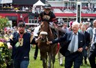 Frank Stronach (right) leads Shaman Ghost into the winner's circle at Pimlico Race Course