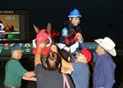 Trainer Joe Offolter (right) ranks second in the trainer standings at Will Rogers Downs