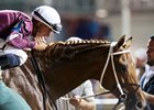 Florent Geroux celebrates after winning the Stephen Foster aboard Gun Runner