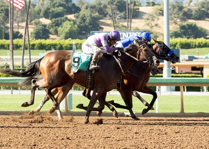 Faypien and jockey Rafael Bejarano, right, outleg Mopotism (Mario Gutierrez), outside, and Spooky Woods (Flavien Prat), inside, to win the Grade II, $200,000 Summertime Oaks, Saturday, June 17, 2017 at Santa Anita Park, Arcadia CA.