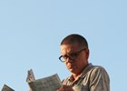 A track patron studies the Daily Racing Form at Churchill Downs