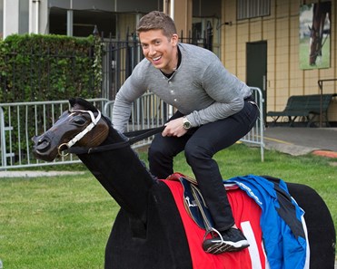 Baruch Shemtov with Good Day New York and Fox News tries out the equicizer equipment for jockeys during segment on jockeys with Mike Luzzi.