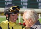 Racing Hall of Fame trainer Jerry Hollendorfer congratulates Evin Roman after the apprentice jockey earned his first stakes win in the Southern Truce Stakes on Street Surrender