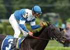 Murphy Award winner Ramon Dominguez gives Better Talk Now a pat on the back after Sword Dancer win.