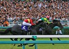 Satono Crown (pink cap) sprints past Gold Actor in the final strides of the June 25 Takarazuka Kinen
