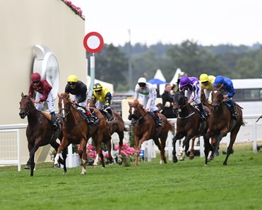 Stradivarius (yellow cap) and Andrea Atzeni win the Group 2 Queen's Vase Stakes, Royal Ascot, Ascot, UK,
