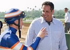 Trainer Phil D'Amato speaks with jockey Flavien Prat at Santa Anita