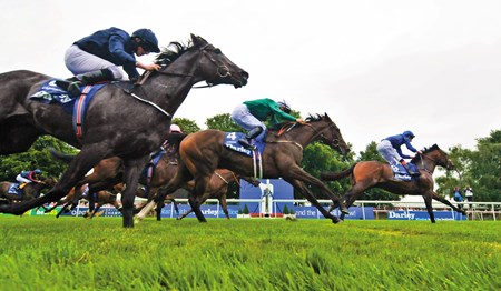 Harry Angel and Adam Kirby win the Darley July Cup at Newmarket.
