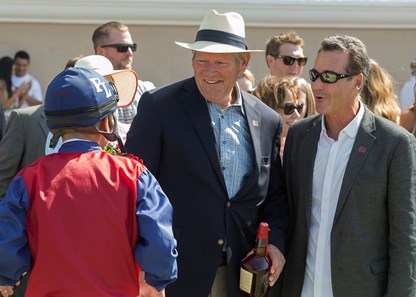 Owner's Alan Klein, right, and Phil Lebherz, second from left, celebrate with jockey Mike Smith, left, after Miss Sunset's victory in the 2017 Fleet Treat Stakes