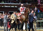 Owners William Lawrence (left) and Seth Klarman (right) walk Practical Joke after his H. Allen Jerkens Stakes score