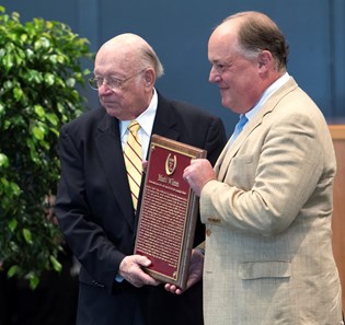 Richard Herrmann, great-grandson of Matt Winn receives the Hall of Fame plaque from Edward Bowen