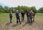 U.S. Marine Corp. veteran Sgt. Matt Ryba visiting with ex-racehorse Crafty at the Bergen Equestrian Center