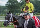 Owner Randy Gullatt leads Pure Silver into winner's circle after the Adirondack Stakes