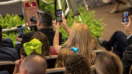 Cell phone users record the event at the National Museum of Racing and Hall of Fame induction ceremony held Aug. 4, 2017 at the Fasig Tipton auditorium in Saratoga Springs, N.Y.