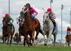 Patrick Husbands guides Conquest Panthera (pink silks) to victory in the Play the King Stakes