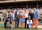 Hunt's connections celebrate their runner's win and automatic berth to the Breeders' Cup Turf