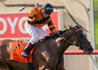Jockey Drayden Van Dyke celebrates his win aboard Cambodia in the Yellow Ribbon Handicap
