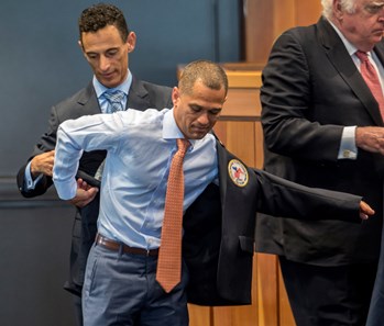 Hall of Fame jockey John Velazquez helps Class of 2017 inductee Javier Castellano with his honorary HOF jacket at the National Museum of Racing and Hall of Fame induction ceremony held Aug. 4, 2017 at the Fasig Tipton auditorium in Saratoga Springs, N.Y.